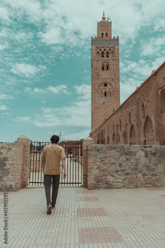 person walking in mosque, marrakech 