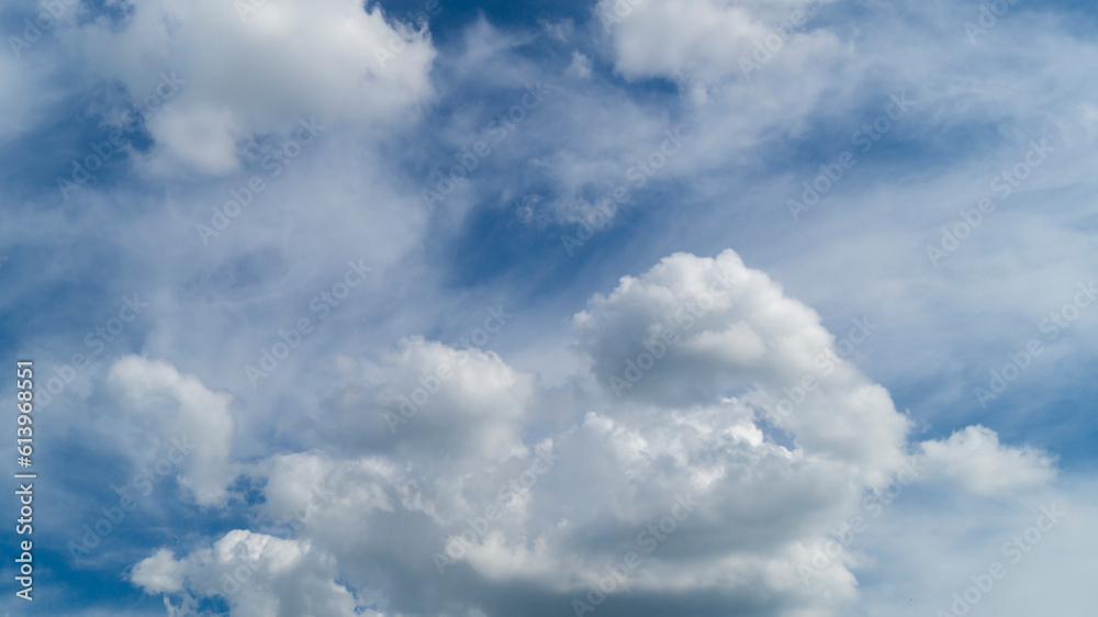 Clouds in the sky. Fluffy white clouds. The sky on a sunny day Clouds in the sky. Fluffy white clouds. The sky on a sunny day