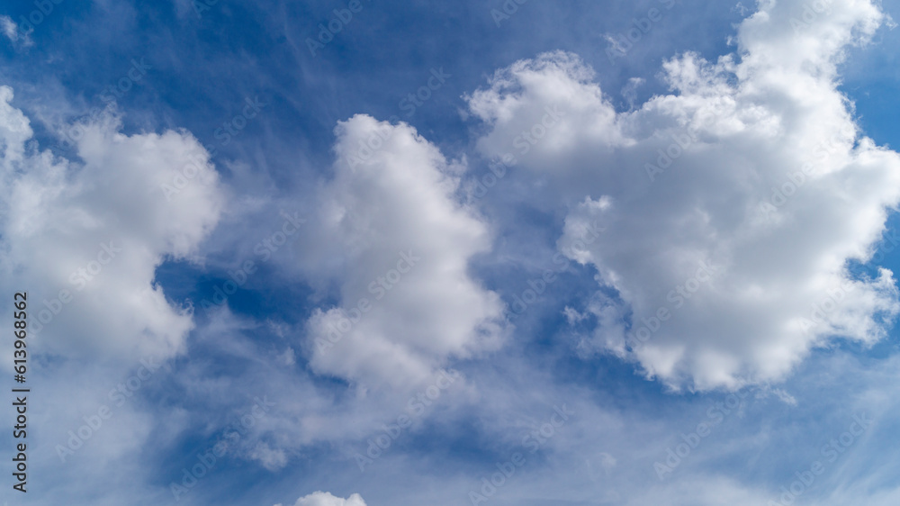 Clouds in the sky. Fluffy white clouds. The sky on a sunny day Clouds in the sky. Fluffy white clouds. The sky on a sunny day