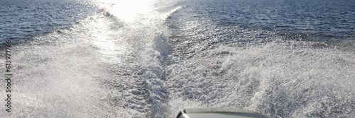 Black outboard engine and powerful boat for sea photo