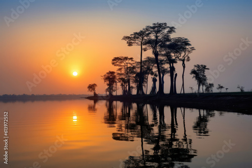 A breathtaking sunset over a tranquil lake, with vibrant hues reflecting on the calm water surface, capturing the beauty of the natural world in all its glory