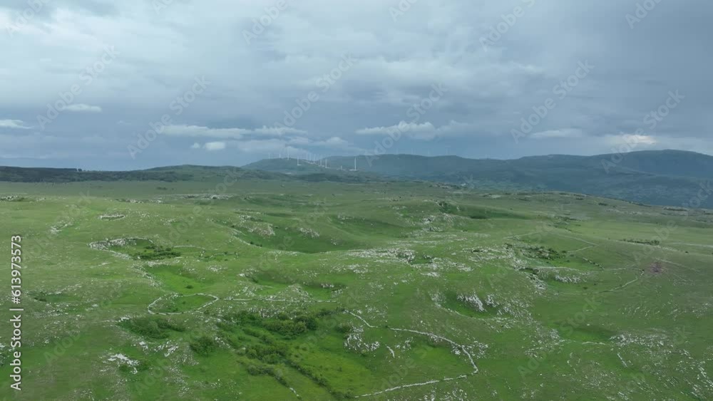 Aerial view of countryside landscape. Clouds with shades of purple, orange and green vegetation. Dramatic sky. Aerial view of countryside landscape. Clouds with shades of purple, orange and green vegetation. Dramatic sky.