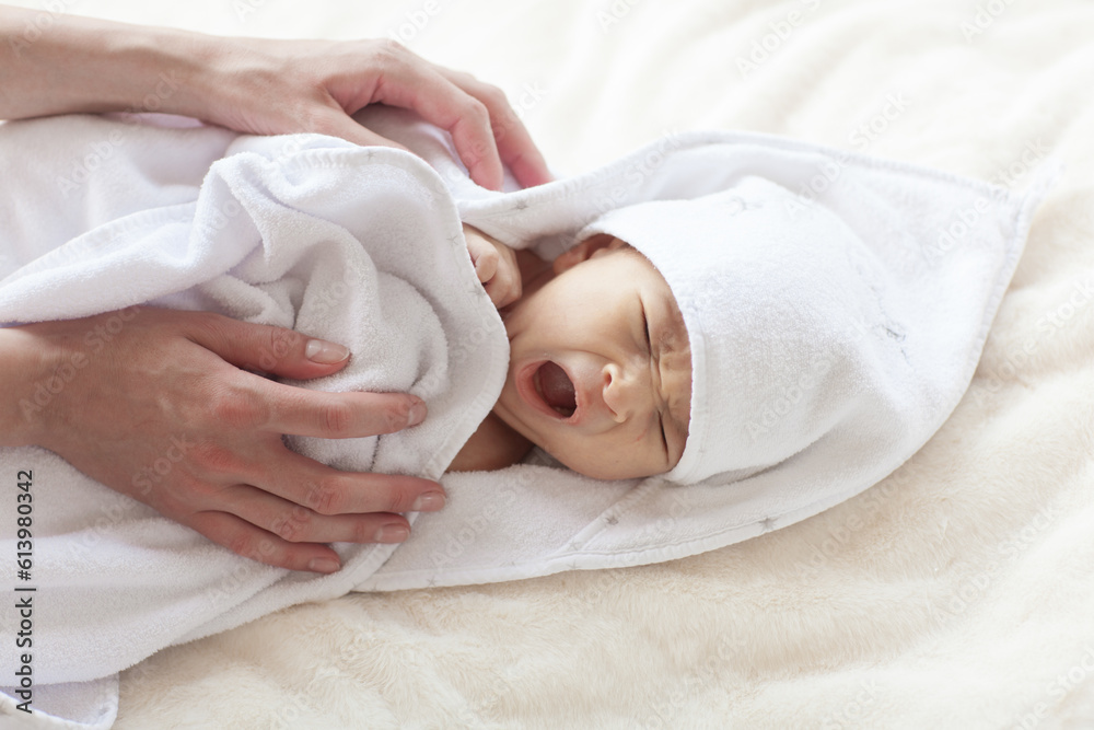 Cute newborn baby during care procedures. Cute newborn baby during care procedures.