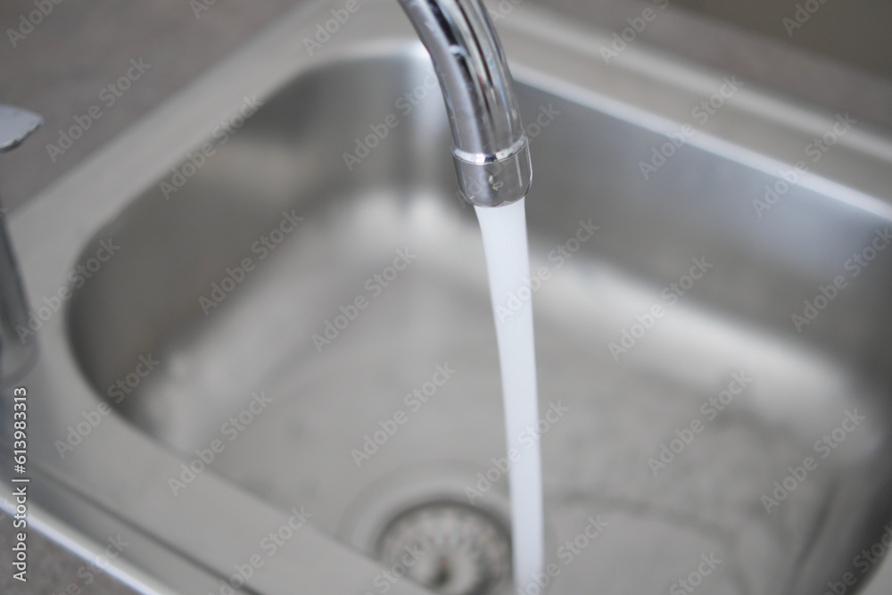 water pouring from a faucet tap slow motion water pouring from a faucet tap slow motion