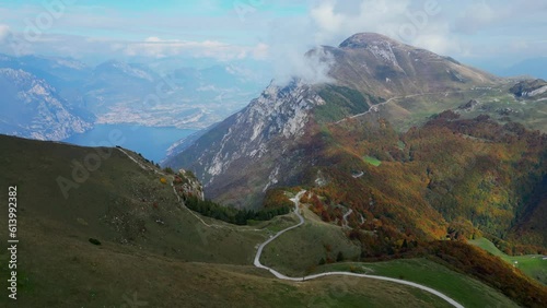 aerial video view of lake Garda and clouds on Monte Baldo mountains in Italy
