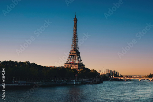 The Eiffel Tower across the Seine River in Paris, France. Sunset. Sunny day in the late afternoon