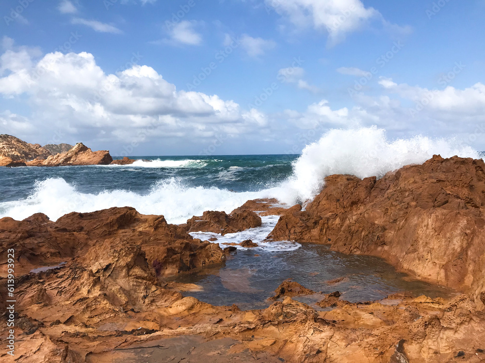 Crashing waves on rocks in Menorca, Spain