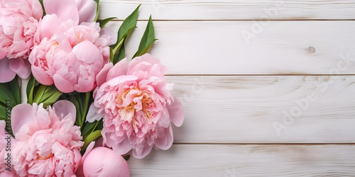 Peony flowers on white wooden background, spring flat lay banner. Valentine's, womens, mothers day, birthday or wedding concept. Top view. Copy space. Generated AI.