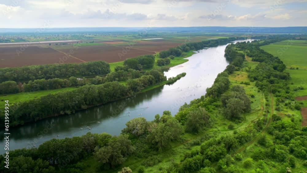 Aerial drone view of people swimming and sup surfing on Nistru river in Moldova Aerial drone view of people swimming and sup surfing on Nistru river in Moldova