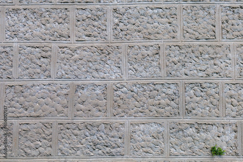 Plaster imitating natural stone. Rough textured wall surface. Background or backdrop. Blank for design