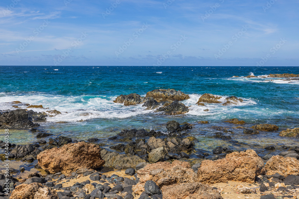 Beautiful view of nature. Stone shore washed by waves of Caribbean sea. Aruba. Beautiful view of nature. Stone shore washed by waves of Caribbean sea. Aruba.