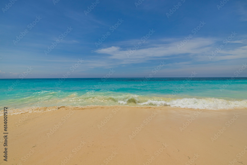 Beautiful nature view of coastline with turquoise waves incoming on sandy beach Atlantic Ocean. Aruba.
