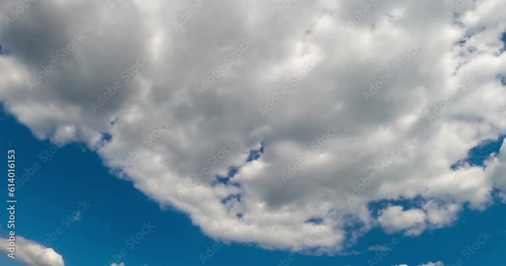 Cloudscape in the azure sky. Big cloud dissolving into little white clouds. Low angle view. Timelapse. Cloudscape in the azure sky. Big cloud dissolving into little white clouds. Low angle view. Timelapse.