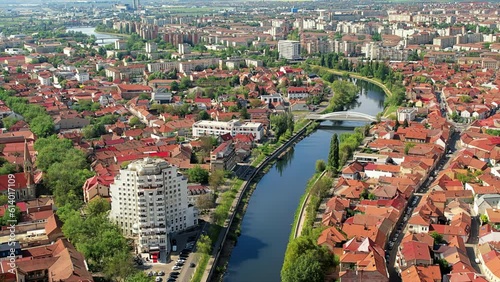 Aerial drone view of Oradea downtown, Romania. Cityscape with multiple historical buildings made in classic style, Crisul Repede river, greenery photo