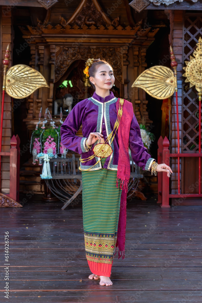 Fototapeta premium Thai woman dressed in traditional Northern Thailand culture costume.