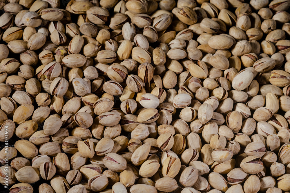 Pistachios background. Pistachio nuts close up. Pistachios background. Pistachio nuts close up.