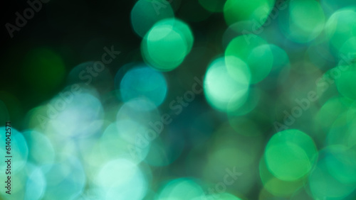 Abstract bokeh lights with green blurred light background