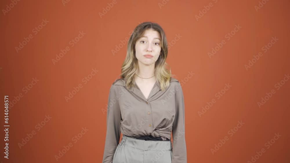 Young woman looking at camera with curious expression. Young woman looking at camera with curious expression.