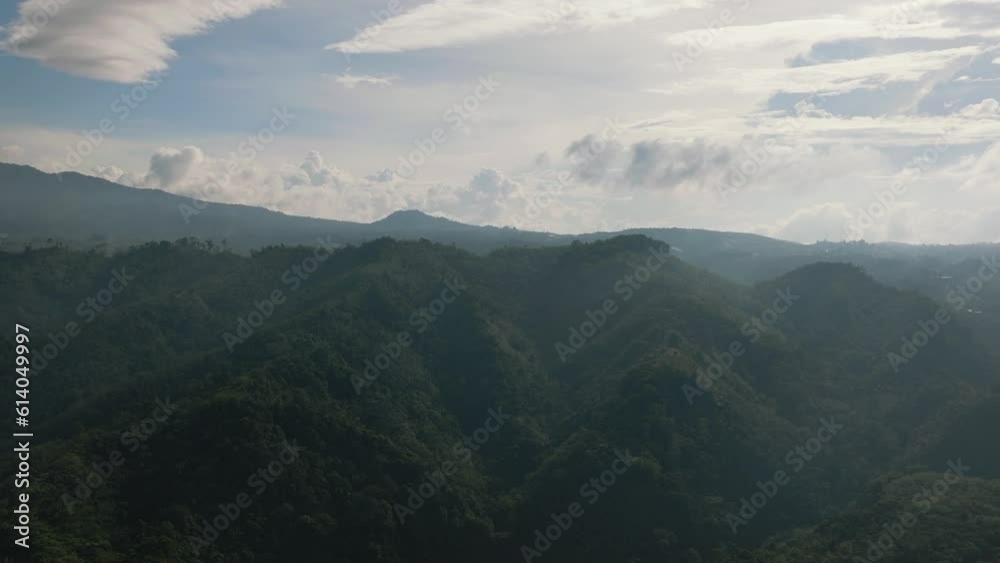 Aerial view of mountain slopes covered with rainforest and jungle. Sumatra, Indonesia. Aerial view of mountain slopes covered with rainforest and jungle. Sumatra, Indonesia.