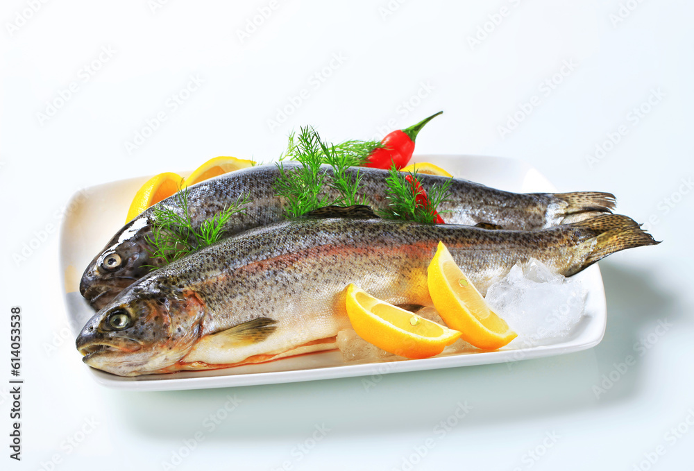two fresh trout on plate