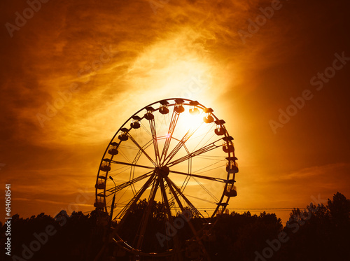 Ferris wheel during sunset time landscape backdrop