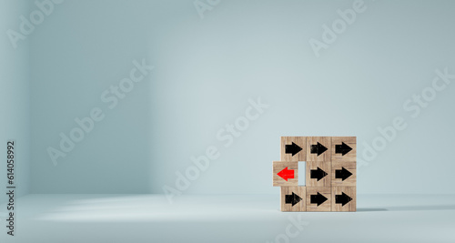 Wooden blocks with red arrows facing opposite black arrows, unique, different thinking, individual and stand out from the crowd concept.