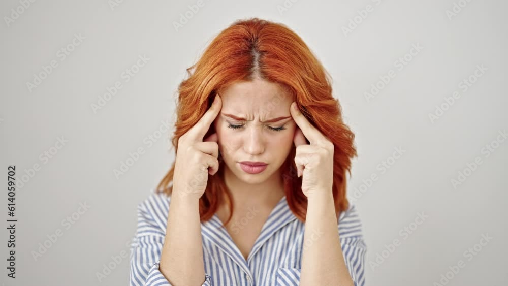 Young redhead woman stressed standing over isolated white background Young redhead woman stressed standing over isolated white background