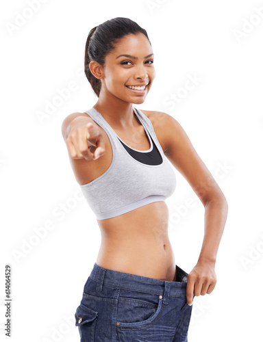 Woman, portrait and baggy jeans with hand pointing on isolated, transparent and png background. You, finger and female face with lose weight, exercise or healthy lifestyle, results or diet motivation © Harsh Shrikant/peopleimages.com