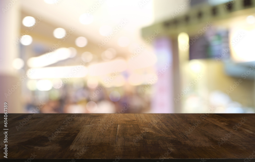 Empty wooden table in front of abstract blurred background of coffee shop . can be used for display or montage your products.Mock up for display of product.