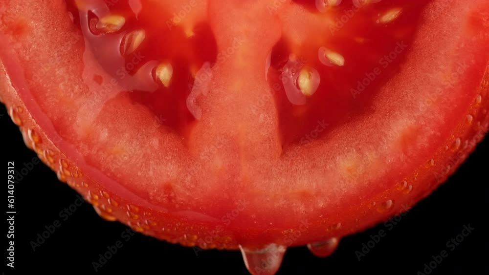 Fresh organic red tomato with water drops, isolated on black background Fresh organic red tomato with water drops, isolated on black background