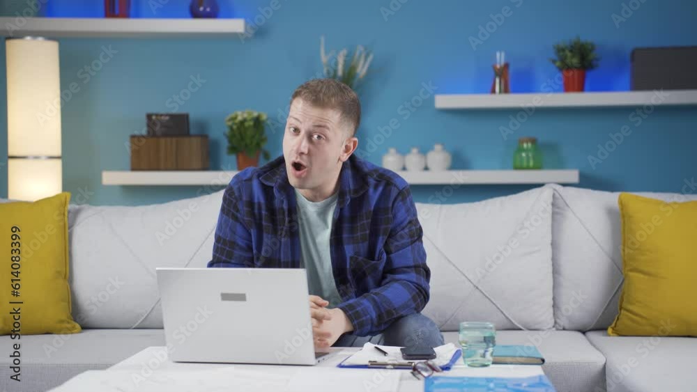 Home office worker man says wow to camera. Home office worker man says wow to camera.