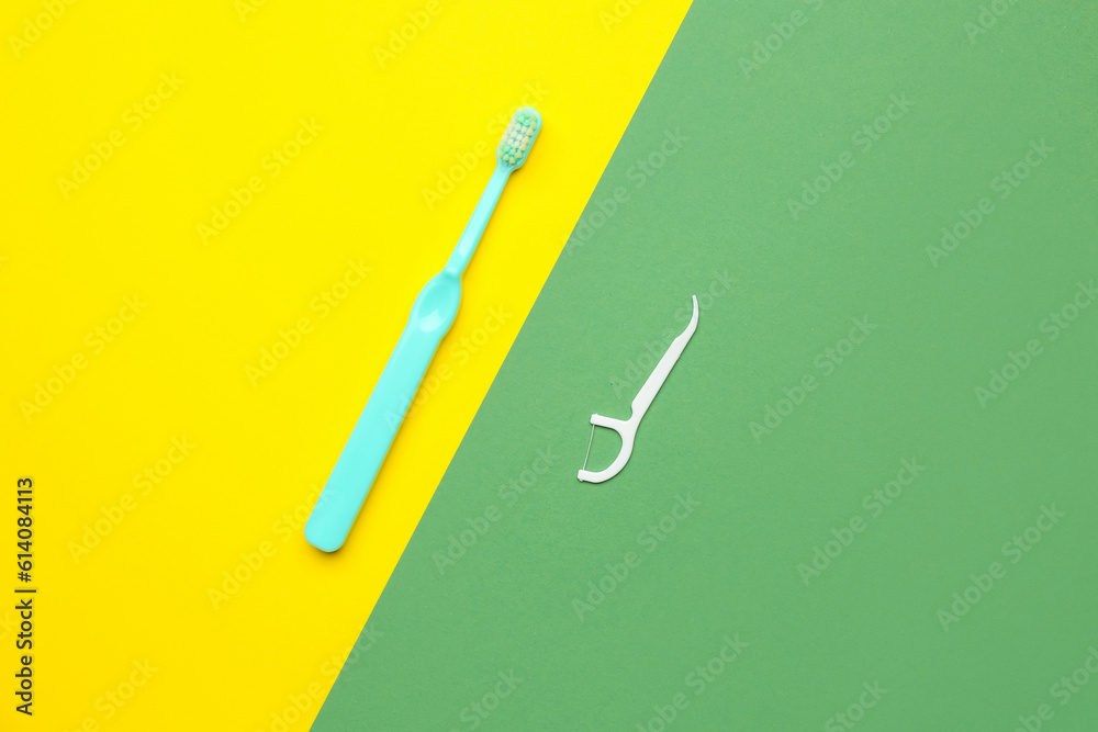 Floss toothpick and brush on colorful background Floss toothpick and brush on colorful background