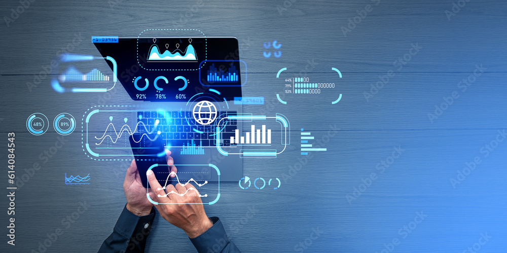 Fototapeta premium Businessman working with phone and laptop, key performance indicators and analysis