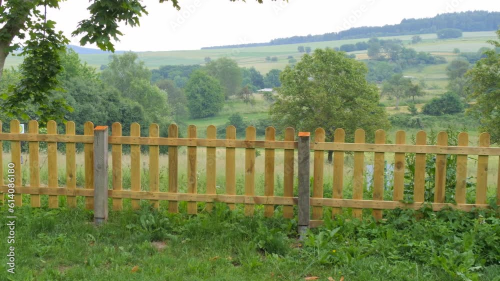 Incredibly beautiful picturesque view of the natural landscape with hills and trees everywhere the village fence Incredibly beautiful picturesque view of the natural landscape with hills and trees everywhere the village fence