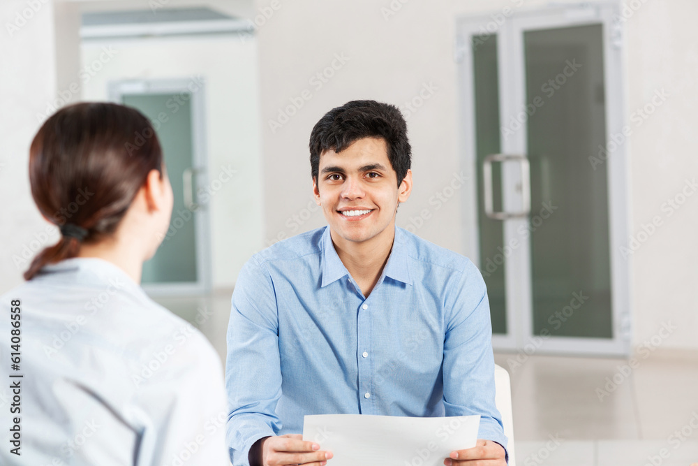 portrait of a young man at a business meeting portrait of a young man at a business meeting