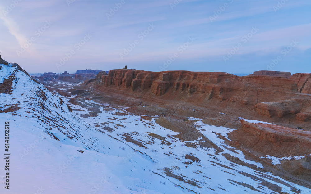 The Snow Scenery, Sunset, and Mountains of the Ghost City, a Famous Scenic Area in Xinjiang, China