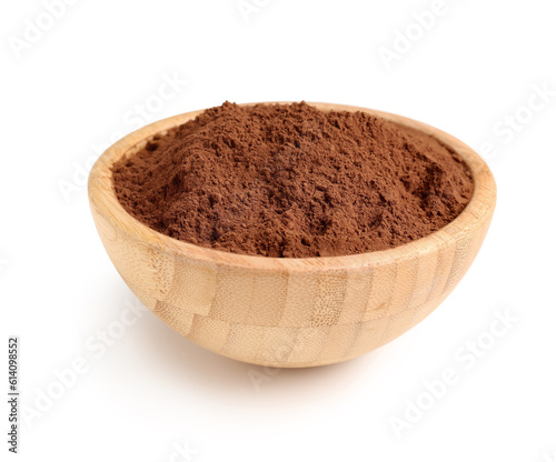 Wooden bowl with cacao powder on white background