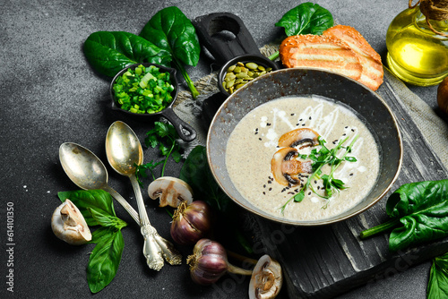 Vegan Mushroom cream soup with mushrooms and cream. In a bowl. The concept of vegetarian food.