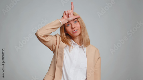Foto Business woman showing loser gesture and pointing on you, blaming accusing for unsuccess, expressing disrespect, mocking your failure, bullying abuse
