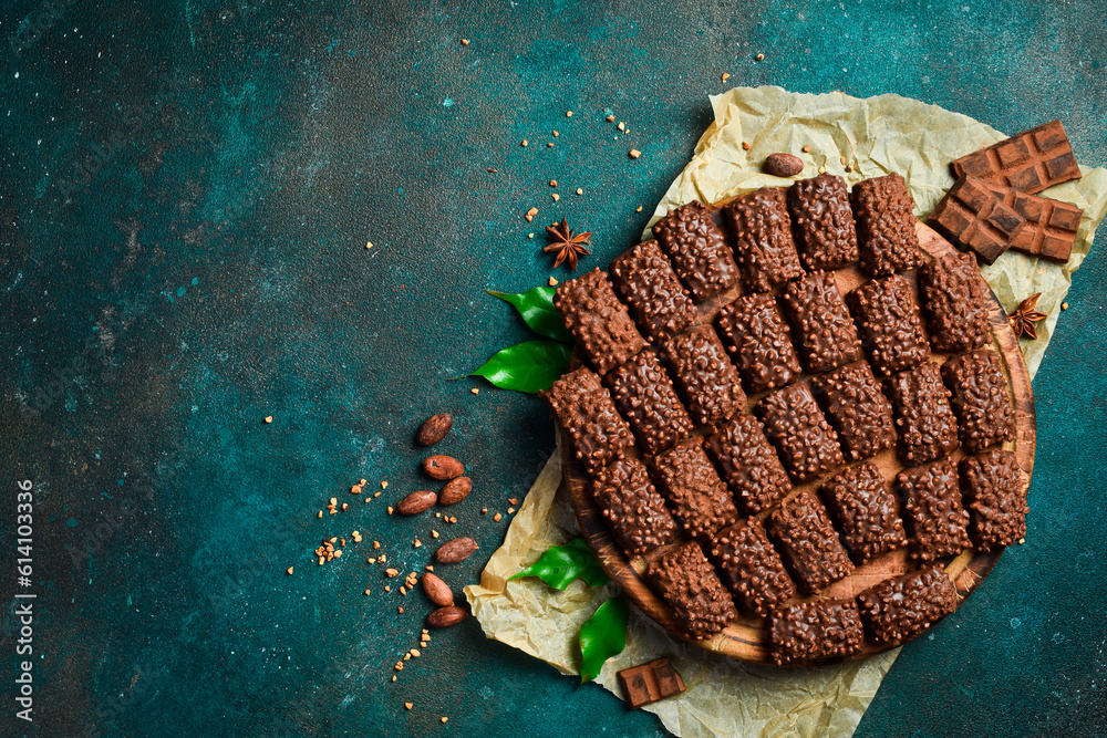 Cookies, chocolate, cocoa and nuts. Dessert. Top view. On a dark background. Space for text. Cookies, chocolate, cocoa and nuts. Dessert. Top view. On a dark background. Space for text.