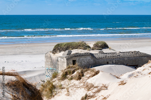 Blåvand beach with blue sky, north sea wall, bunker