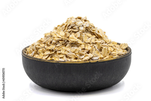 Oatmeal or Oat flakes isolated on white background. Oatmeal in bowl. Close up