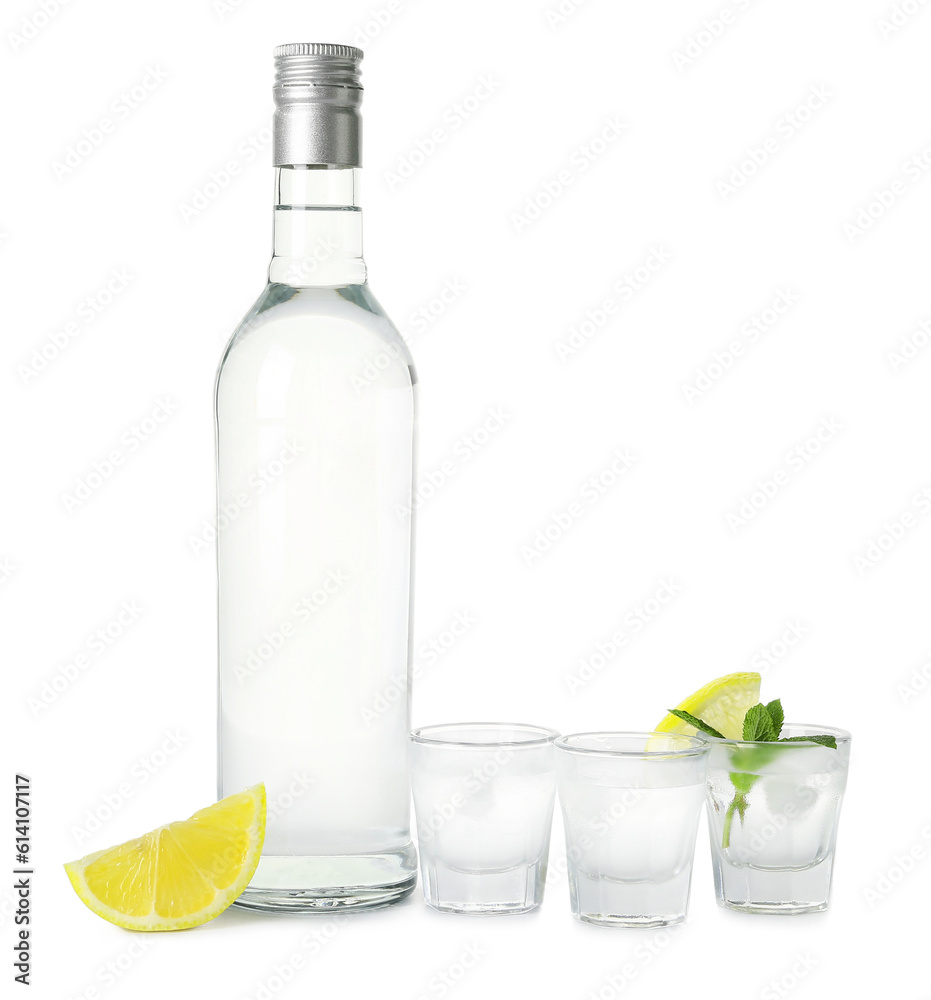 Bottle and glasses of vodka isolated on white background Bottle and glasses of vodka isolated on white background