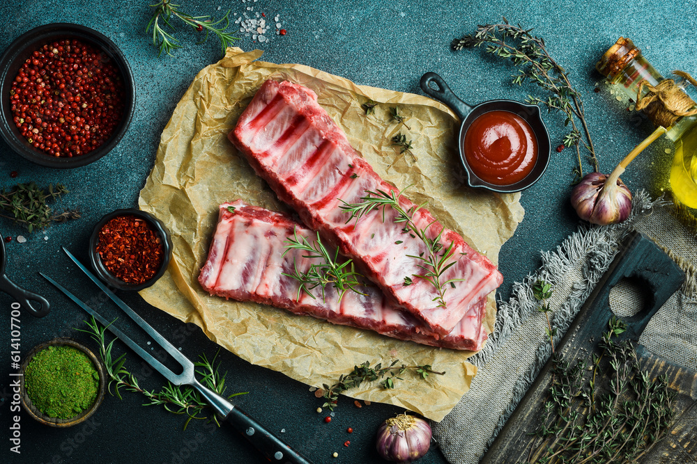 Meat. Raw Pork ribs with rosemary. Top view. Rustic style.