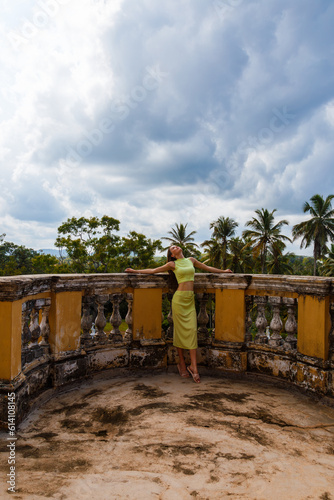European woman on the terrace of a mansion in Sri Lanka
