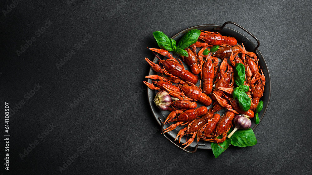 Freshly boiled red crayfish on a metal kitchen tray. Seafood, beer snacks. Free space for text. Freshly boiled red crayfish on a metal kitchen tray. Seafood, beer snacks. Free space for text.