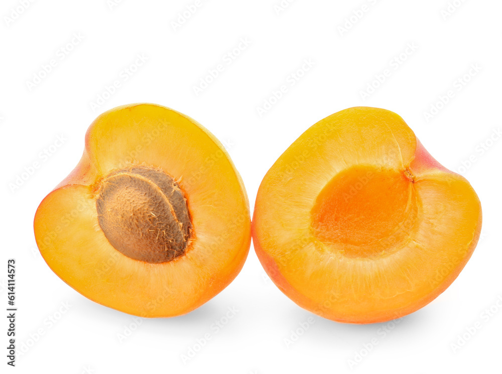 Halves of ripe apricot isolated on white background