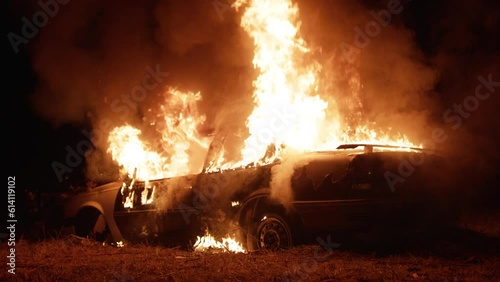 Car on fire at night