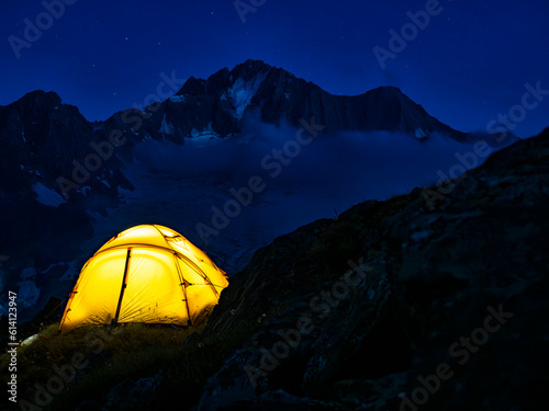 Camping tent at night in the Italian alps