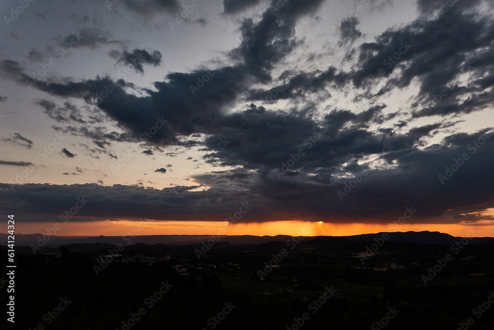 The rain falls on the sunset in the Llaberia Nature Reserve. Tarragona. Catalonia. Spain The rain falls on the sunset in the Llaberia Nature Reserve. Tarragona. Catalonia. Spain
